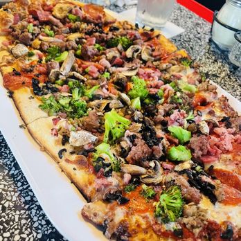 Campisi's Restaurant - Meat Supreme Pizza with broccoli, mushrooms, and black olives - Italian Near Me - Dallas, Texas