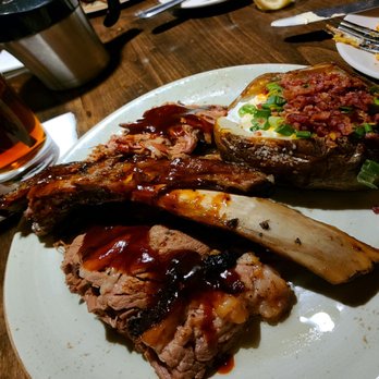 Bobby Q - This is just half of the 3 meat dinner. Brisket, ribs, pulled pork with baked fully loaded potato and grilled corn (not in pic). - Barbeque Near Me - Phoenix, Arizona