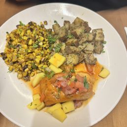 This is the salmon with potatoes, and grilled corn This is the salmon with potatoes, and grilled corn
