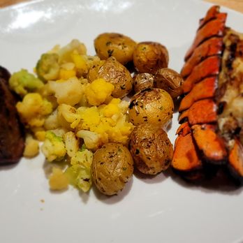 Seasons 52 - 6oz Filet Mignon, Grilled Lobster Tail with tri-colored cauliflower and potatoes. - New American Near Me - Indianapolis, Indiana