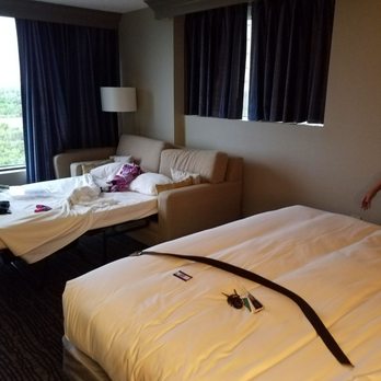 Hilton Cocoa Beach Oceanfront - Room with the bed open - Hotels Near Me - Cocoa Beach, Florida Hilton Cocoa Beach Oceanfront - Room with the bed open - Hotels Near Me - Cocoa Beach, Florida