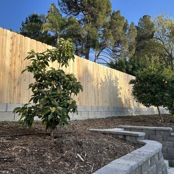 Carmelo's Crew Landscaping - a fenced in garden - Landscaping Near Me