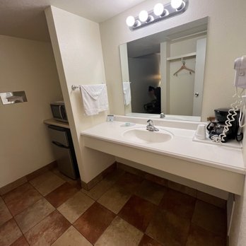 Whites City Cavern Inn - Sink countertop had a lot of space! Minifridge/microwave to the left. - Hotels Near Me - Whites City, New Mexico
