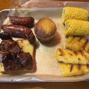 Famous Dave's Bar-B-Que - Two meat plate - jalapeno cheddar sausage, burnt ends, Corn Bread Muffin, sweet corn, and grilled pineapple - Barbeque Near Me - Kalispell, Montana