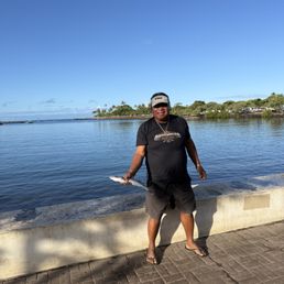 Fisherman with his Barracuda Breakfast. Fisherman with his Barracuda Breakfast.