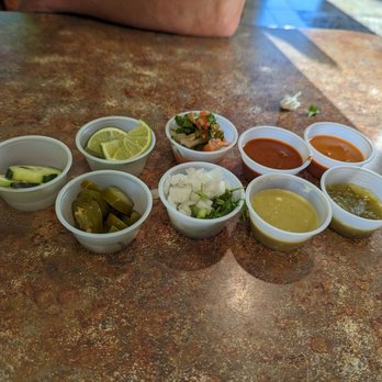 Costilla Grill - a variety of condiments on a table - Mexican Near Me - Lakeland, Florida Costilla Grill - a variety of condiments on a table - Mexican Near Me - Lakeland, Florida