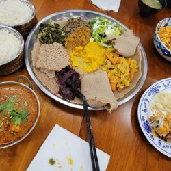 Mango House - Dhal and Chicken Tikka (from Nepalese place) Vegetarian plate (from Ethiopian place), Sushi roll, Noodle dish (from Burmese place).