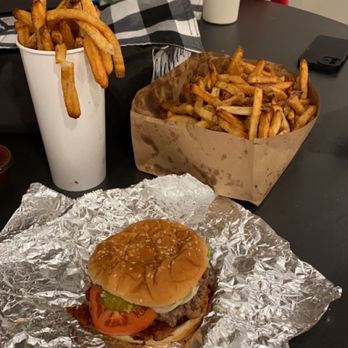 Five Guys - a hamburger and french fries on a table - Burgers Near Me - Omaha, Nebraska Five Guys - a hamburger and french fries on a table - Burgers Near Me - Omaha, Nebraska