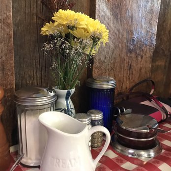 The Kitchen Table - a pitcher of flowers on a table - New American Near Me - Marshfield, Wisconsin The Kitchen Table - a pitcher of flowers on a table - New American Near Me - Marshfield, Wisconsin