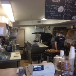 Michael's Coffee Shop & Bakery - Cinnamon bun master at work!