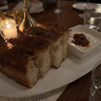 Nick & Toni's - Rosemary, Thyme & Sea Salt Focaccia Honey Ricotta, Tomato Confit Pesto - Italian Near Me - East Hampton, New York Nick & Toni's - Rosemary, Thyme & Sea Salt Focaccia Honey Ricotta, Tomato Confit Pesto - Italian Near Me - East Hampton, New York