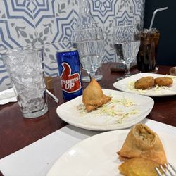 Vegetable Samosa, Aloo Tikki, and Thumbs up cola.