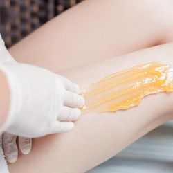 MS Sugaring - A trained technician applies warm sugar paste to remove hairs.
