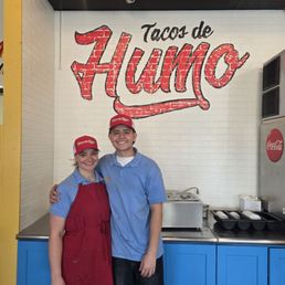 Cassandra and Austin under their business name and sign. Cassandra and Austin under their business name and sign.