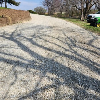 Husband Family Excavating - Spread new rock on a driveway. - Demolition Services Near Me - Gladstone, Illinois Husband Family Excavating - Spread new rock on a driveway. - Demolition Services Near Me - Gladstone, Illinois