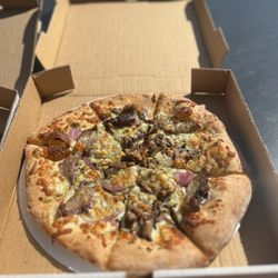 PaPPo’s Pizzeria & Pub - The Steakhouse homemade pesto sauce, sliced top sirloin steak, fresh mushrooms, red onions, asiago & gorgonzola cheese
