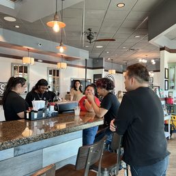 Staff not waiting on customers and drinking champagne!