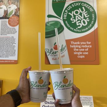Blenders In The Grass- Buellton - a hand holding two cups of blenders - Juice Bars & Smoothies Near Me - Buellton, California Blenders In The Grass- Buellton - a hand holding two cups of blenders - Juice Bars & Smoothies Near Me - Buellton, California