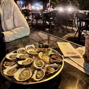Strange Bird - Oysters - four different types on rotation. Hot sauce and cocktail sauce and mignonette sauce to die for!! - Tiki Bars Near Me - Indianapolis, Indiana