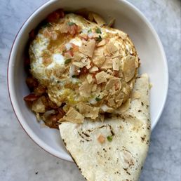 Smokehouse hash roasted bbq pork, crispy potato, charred onion, poblano pepper, sunny side up egg (changed to fried), flour tortilla