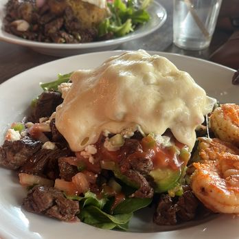 Bistro Cafe - Stuffed avocado , with shrimp and steak covered with mozzarella, mouth watering - Breakfast & Brunch Near Me - Miami, Florida Bistro Cafe - Stuffed avocado , with shrimp and steak covered with mozzarella, mouth watering - Breakfast & Brunch Near Me - Miami, Florida