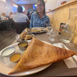 Udupi Krishna - Mysore Masala Dosa, with samosas in the midground, and Kelly and her special dosa in the background