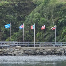 Caledonian MacBrayne - This Isle is a bit angry at the US President!! Flags at the ferry!