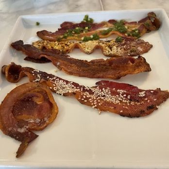 Immigrant Son Caffe - Bacon flight! Pancetta, honey sesame, applewood smoked, Parmesan, and jalapeño. Mmm. - New American Near Me - Ventura, California