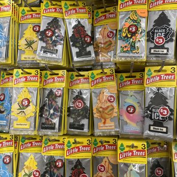 Dollar Tree - $3 & $5 - A collection of Little Trees air fresheners in different scents and designs, hanging on a store display, each priced at $3. - Discount Store Near Me - Tomball, Texas
