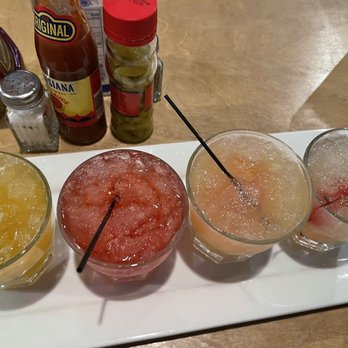 Rolling River Reloaded - Cocktail Flight  Mango Hennessy, Tom Collins, Rum Punch, Whiskey Sour - Southern Near Me - Natchez, Mississippi