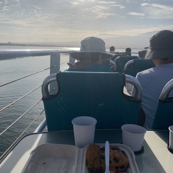 Calypso Charters - Enjoying breakfast in the harbor. Muffin. Bread. Fruit. Juice. - Snorkeling Near Me - Wailuku, Hawaii