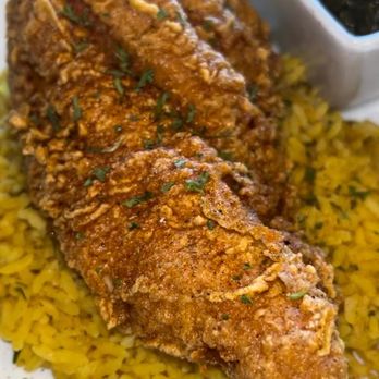 Fat Boiz - Fried catfish over yellow rice - Beer, Wine & Spirits Near Me - McDonough, Georgia Fat Boiz - Fried catfish over yellow rice - Beer, Wine & Spirits Near Me - McDonough, Georgia