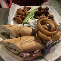 Grilled chicken sandwich with onion rings & two pounds of wings
