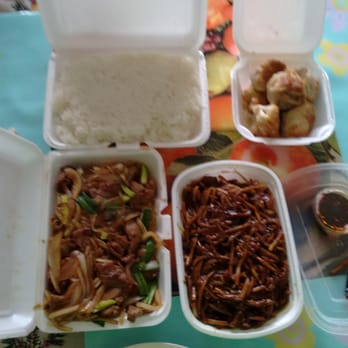 Peking Garden Restaurant - (top left to bottom right) rice, potstickers, Mongolian beef, Mandarin beef, sauce for potstickers - Chinese Near Me - Champaign, Illinois