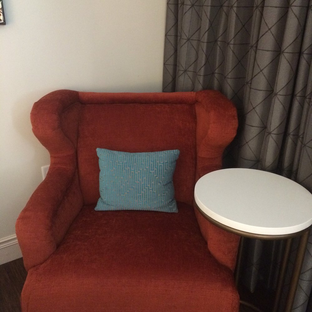 Hotel Indigo Baltimore Downtown - Chair and table in the corner - Hotels Near Me - Baltimore, Maryland