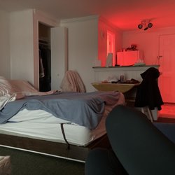 Sandcastle Resort and Club - Bed and kitchen. Red light is from the bathroom's heat lamp.