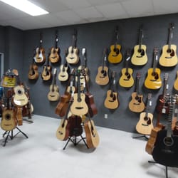 Melhart Music Center - Great selection of classical and acoustic guitars to choose from!