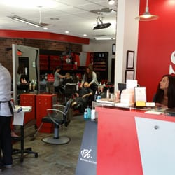Yellow Strawberry Salon at Lakewood Ranch - Reception desk and salon stations.