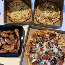Cheese sticks, potato pizza, supreme pizza and hot garlic wings Cheese sticks, potato pizza, supreme pizza and hot garlic wings
