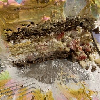 El Bolillo Bakery - The sliced cake. Usually when you ask for extra wet the bottom of the cake base is somewhat wet. This one isn't even moist! - Bakeries Near Me - Pasadena, Texas