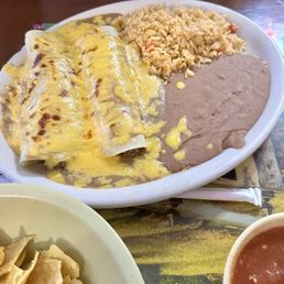 $8.99 (July 2024) Beef enchiladas lunch special. It comes with a drink! Enchilada gravy....drool! $8.99 (July 2024) Beef enchiladas lunch special. It comes with a drink! Enchilada gravy....drool!