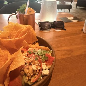 Earls Kitchen + Bar - Avocado dip and strawberry hibiscus mule cocktail - New American Near Me - Fort Lauderdale, Florida Earls Kitchen + Bar - Avocado dip and strawberry hibiscus mule cocktail - New American Near Me - Fort Lauderdale, Florida