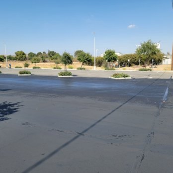 Jimenez Paving - the asphalt surface of a parking lot - General Contractors Near Me