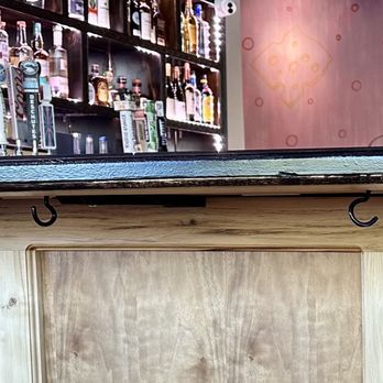 Curry Pizza House Folsom - Purse hooks under the bar top - Pizza Near Me - Folsom, California