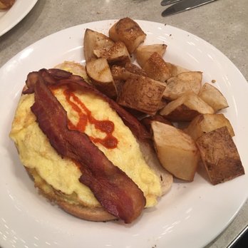 The Paramount - Breakfast toast special: toast, guacamole, grilled tomatoes, eggs and bacon with sriracha served with a side of Cajun potatoes! - Breakfast & Brunch Near Me - Boston, Massachusetts