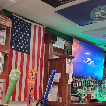 Brady’s Pub - a bar with american flags and a television - Irish Near Me - Key West, Florida Brady’s Pub - a bar with american flags and a television - Irish Near Me - Key West, Florida