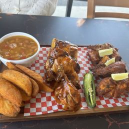 Pollo in habanero mango sauce and other half in zarandeado (my favorite).