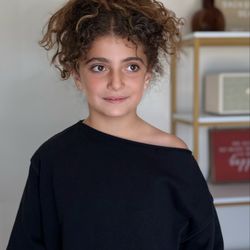 Little fashionista with big hair vibes!