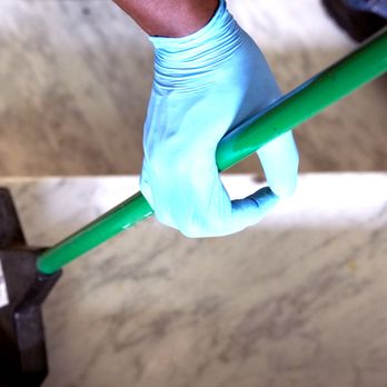 FNBC - a person cleaning a floor with a broom - Office Cleaning Near Me - New York, New York FNBC - a person cleaning a floor with a broom - Office Cleaning Near Me - New York, New York