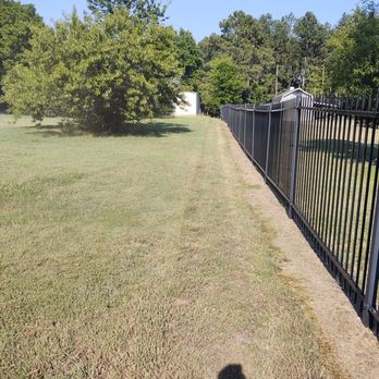 Steven's Lawn Maintenance - a shadow of a person on a fence - Lawn Services Near Me Steven's Lawn Maintenance - a shadow of a person on a fence - Lawn Services Near Me